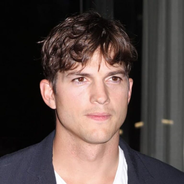 Ashton Kutcher sports a scruffy hairstyle that exudes a laid-back and effortless charm, perfectly capturing his relaxed and casual persona.