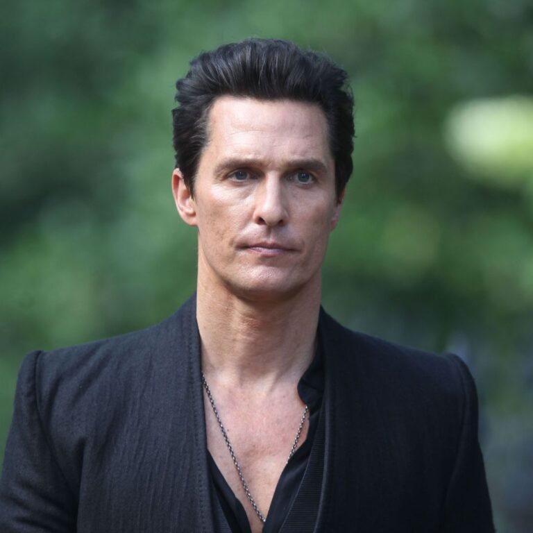 In a captivating movie scene from "The Dark Tower," Matthew McConaughey commands attention with his impeccable style. Dressed in an all-black suit and adorned with a necklace, his classic pompadour hairstyle adds an extra touch of suave sophistication, perfectly reflecting his character's enigmatic and charismatic persona.